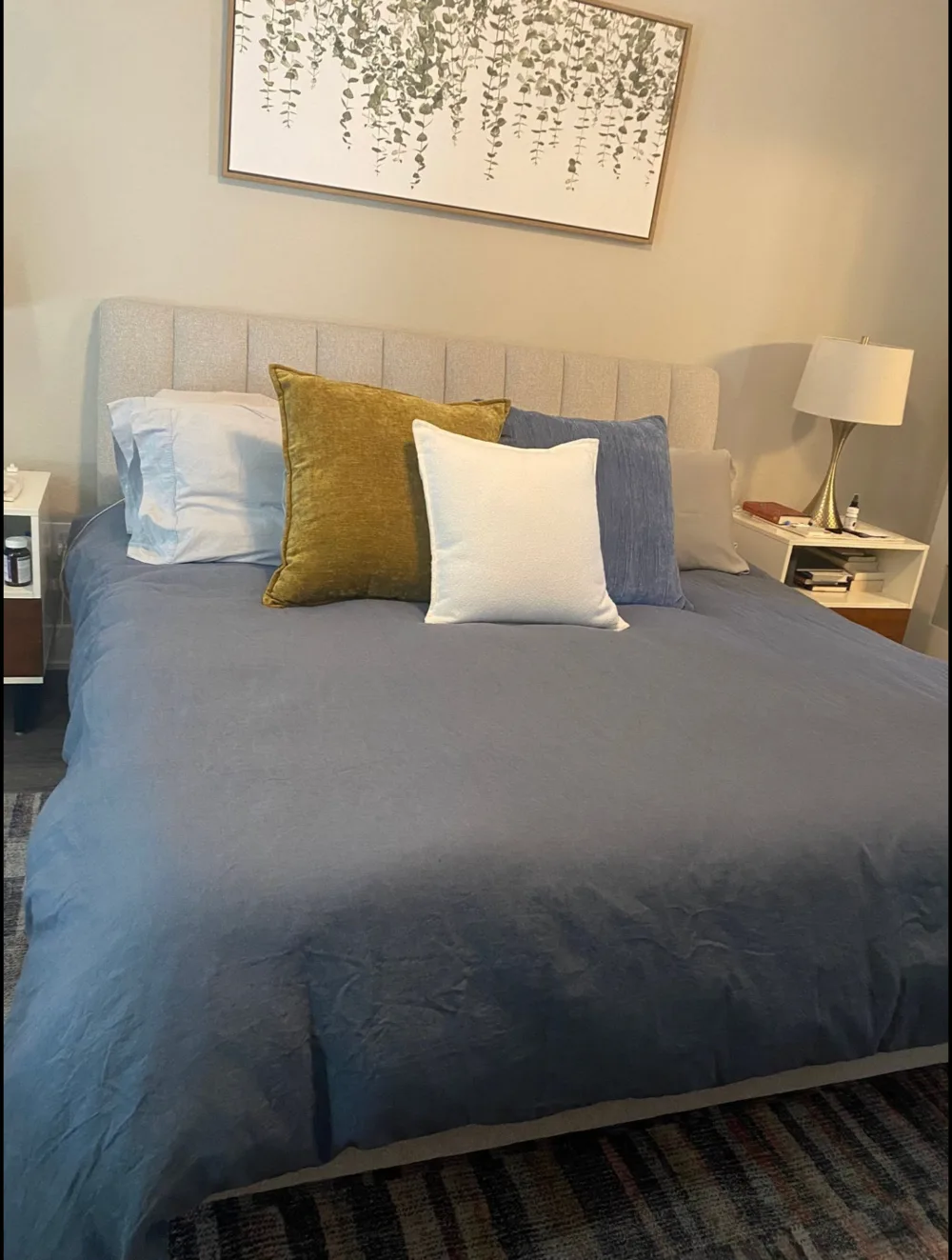 Bedroom after cleaning with neatly made bedding